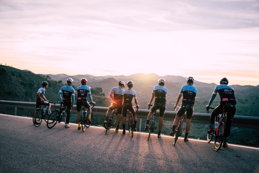 cyclists admiring sunrise - 37CELLS